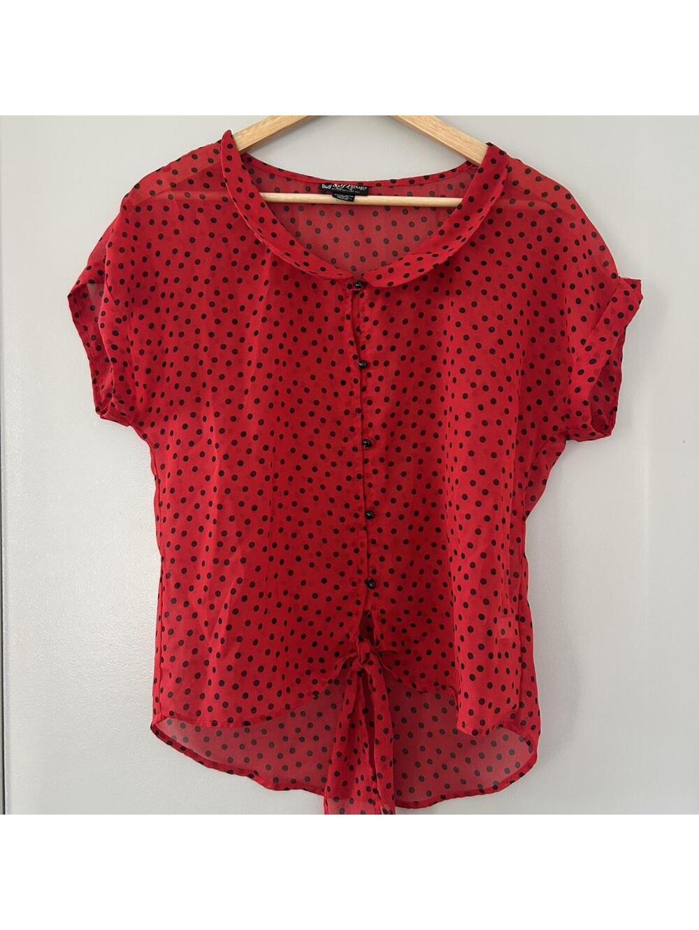 Vintage red polka dot blouse with tie detail and button up front.